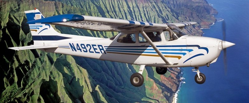 Wings Over Kauai's Cessna tour plane flying over Hawaii