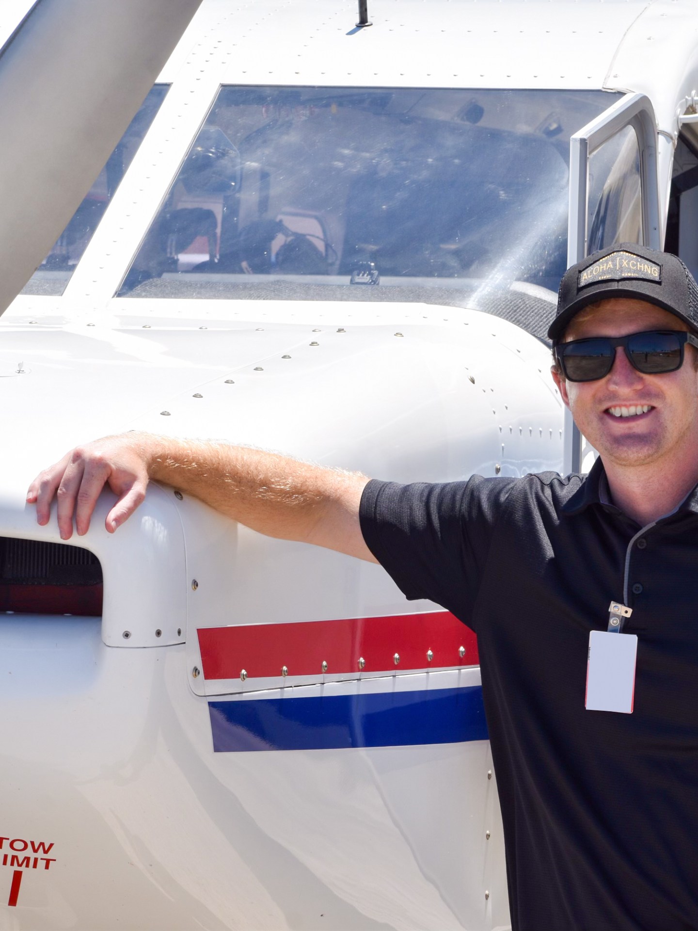 a man standing next to a plane