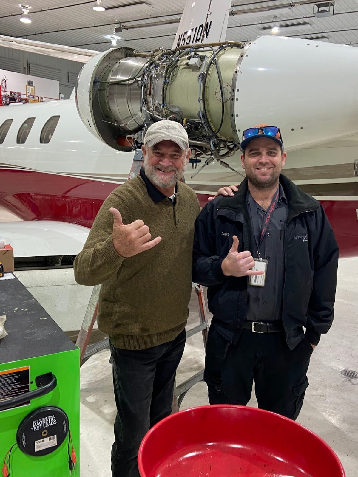 a person standing in front of a plane